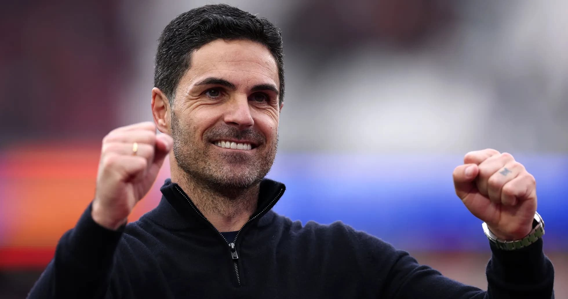 Coach celebrating with clenched fist and smile Coach celebrating with clenched fist and smile