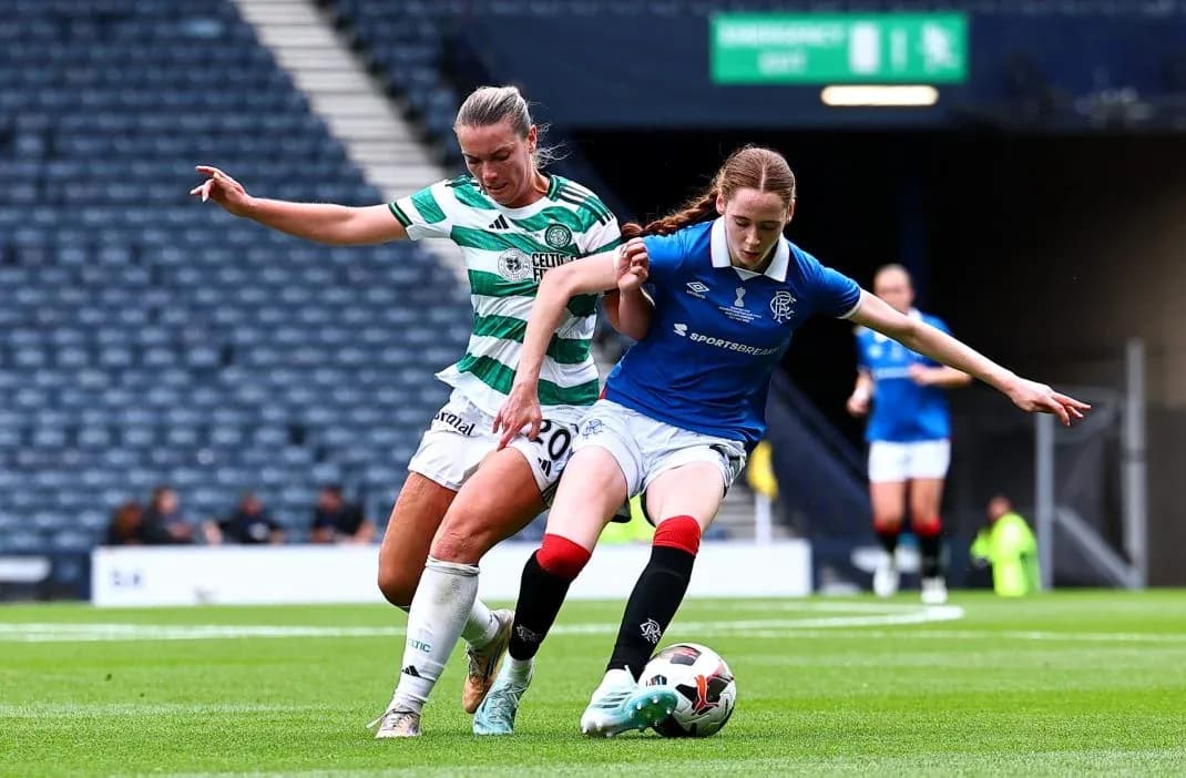 Celtic and Rangers players contesting the ball Celtic and Rangers players contesting the ball