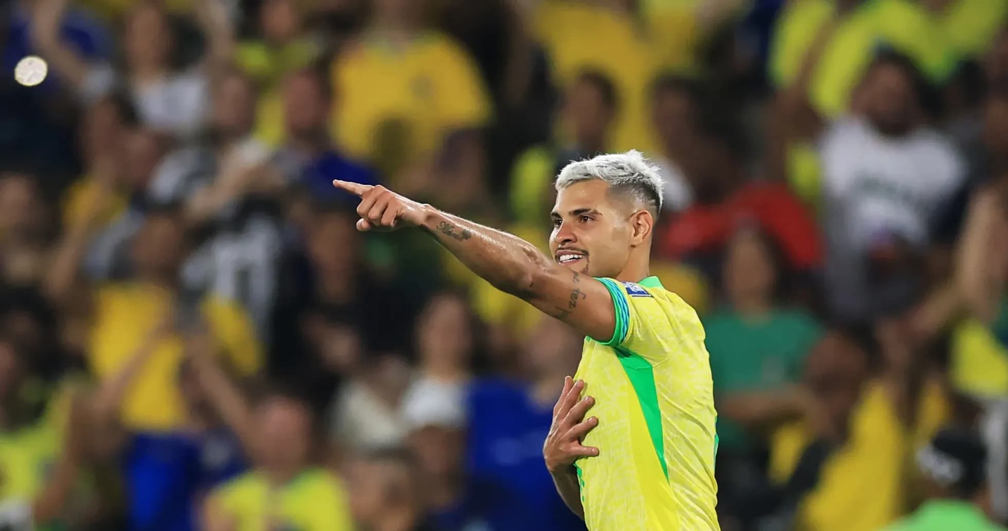 Player celebrating and pointing to fans in stadium Player celebrating and pointing to fans in stadium