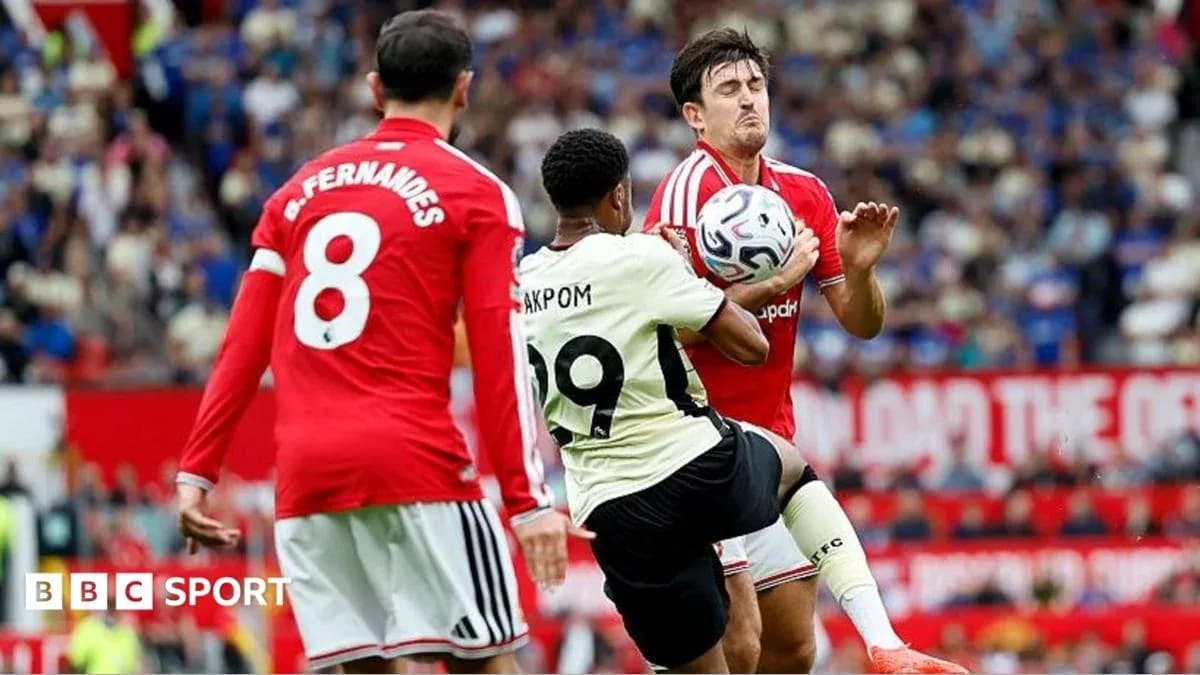 Player challenging for the ball during a match Player challenging for the ball during a match