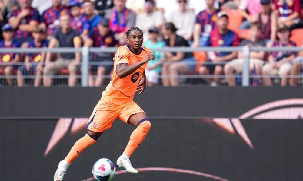 Player in orange kit sprinting on the field Player in orange kit sprinting on the field