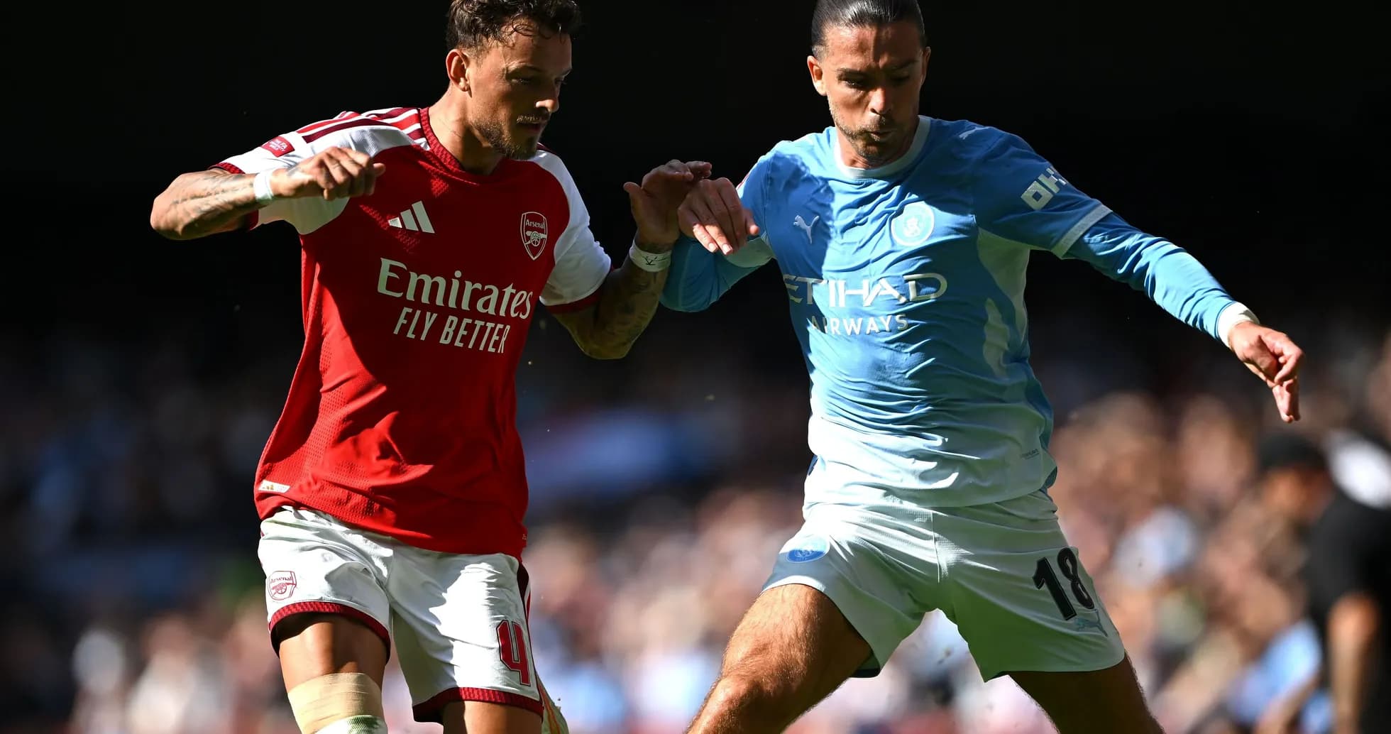Two players challenging for the ball during match Two players challenging for the ball during match