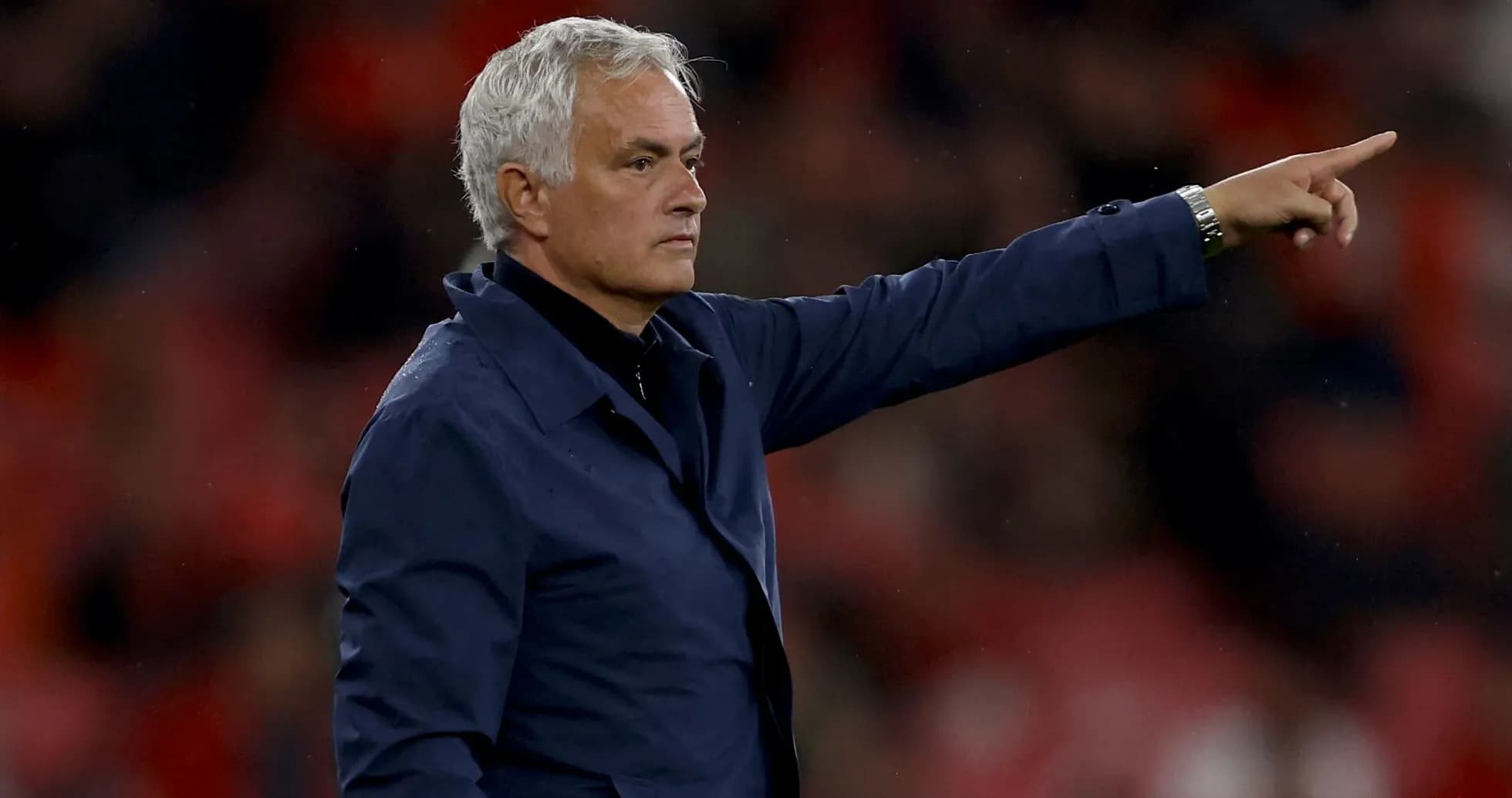 Manager gesturing during match from the sideline Manager gesturing during match from the sideline