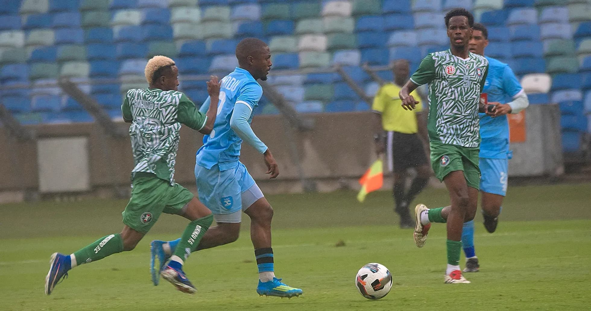 Rukinzo player dribbling past Durban City defenders Rukinzo player dribbling past Durban City defenders