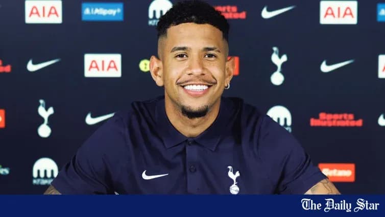 Player smiling at press conference for Tottenham Player smiling at press conference for Tottenham