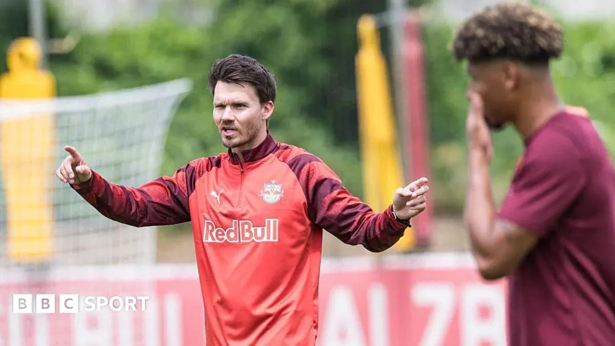 Coach instructing player during training session Coach instructing player during training session