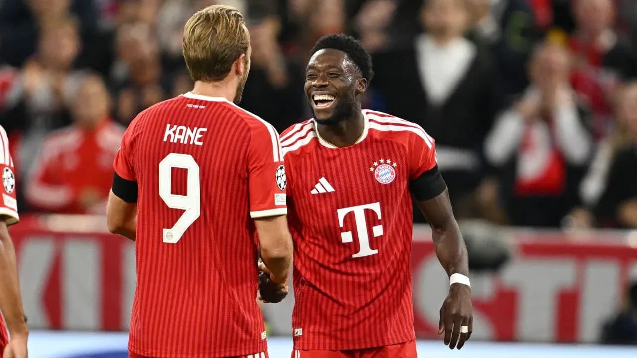 Two Bayern Munich players celebrating on the field Two Bayern Munich players celebrating on the field