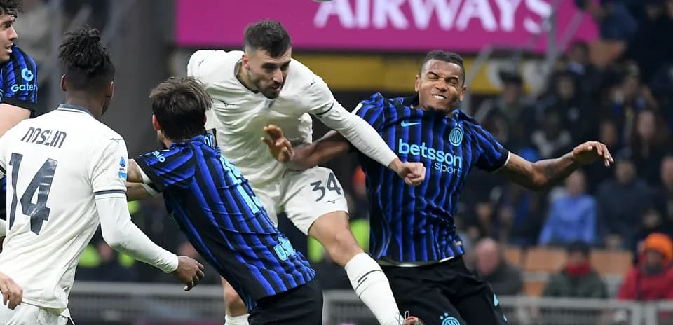 Players contesting a header during Lazio vs Inter match Players contesting a header during Lazio vs Inter match
