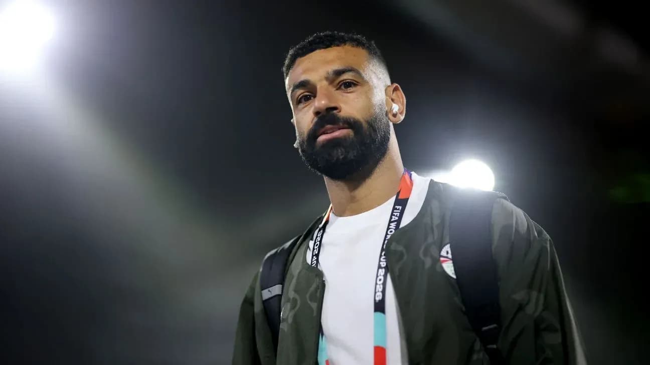 Football player walking with headphones at venue Football player walking with headphones at venue