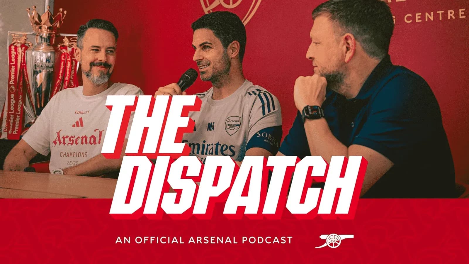 Podcast hosts discussing Arsenal at a table Podcast hosts discussing Arsenal at a table