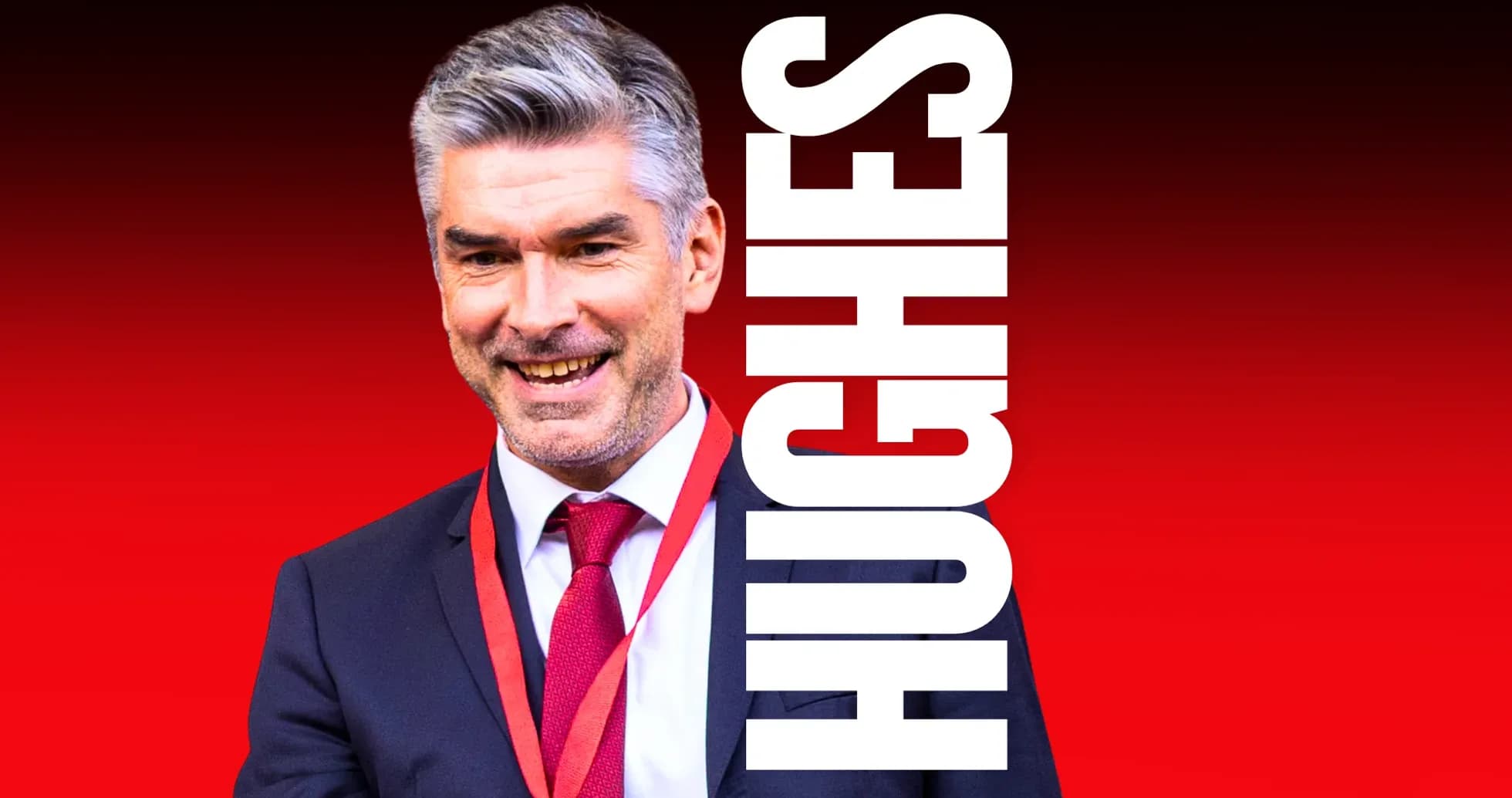 Smiling man in suit with red tie and lanyard Smiling man in suit with red tie and lanyard