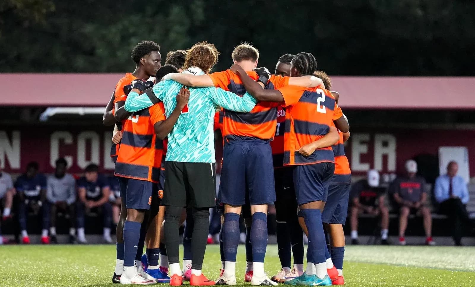 Soccer team huddled together before a match Soccer team huddled together before a match