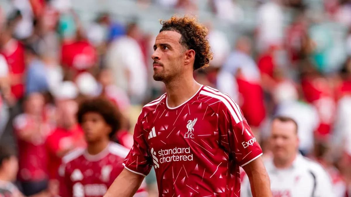 Player in Liverpool jersey walking off the pitch Player in Liverpool jersey walking off the pitch