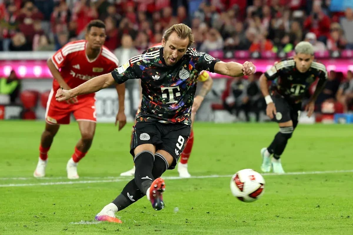 Player kicking the ball during a penalty kick Player kicking the ball during a penalty kick