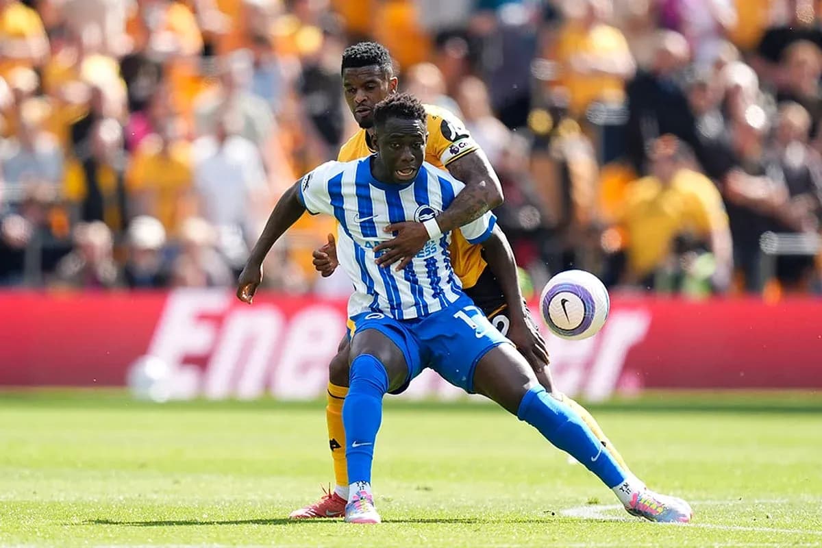 Brighton player challenged by Wolves opponent Brighton player challenged by Wolves opponent