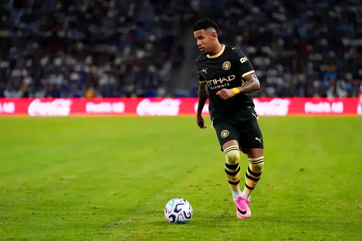 Player dribbling the ball during a match Player dribbling the ball during a match