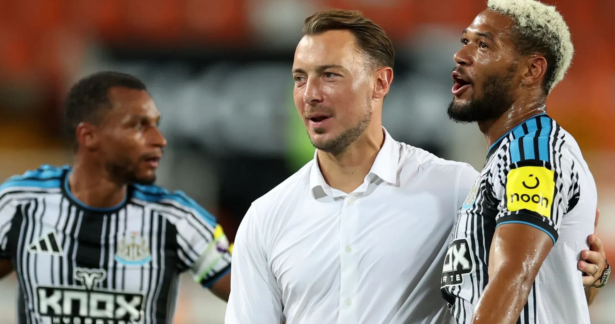Newcastle players celebrating with their manager after match Newcastle players celebrating with their manager after match