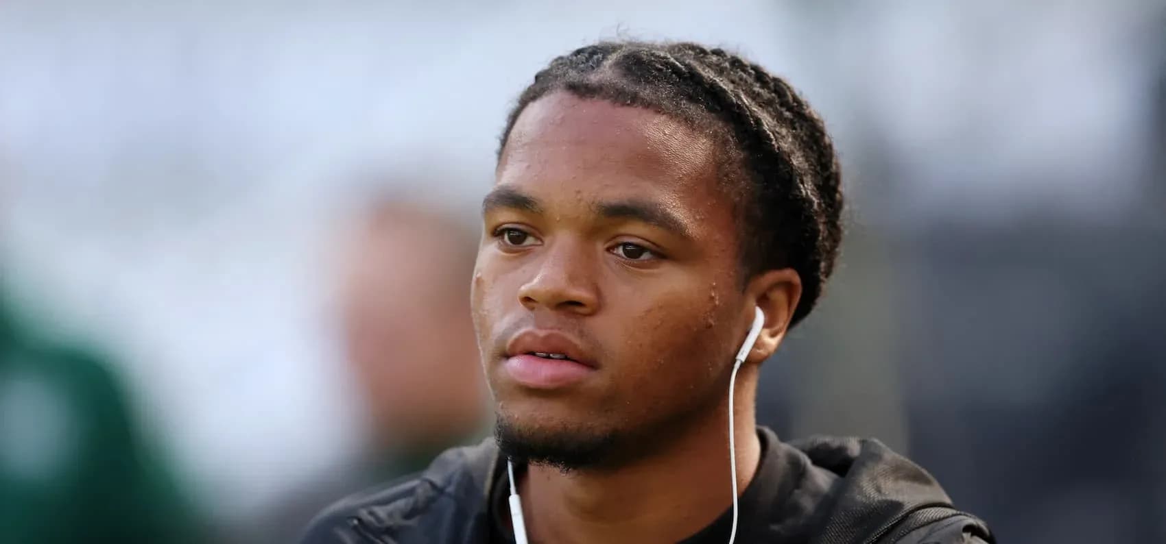 Player wearing earbuds before the match Player wearing earbuds before the match