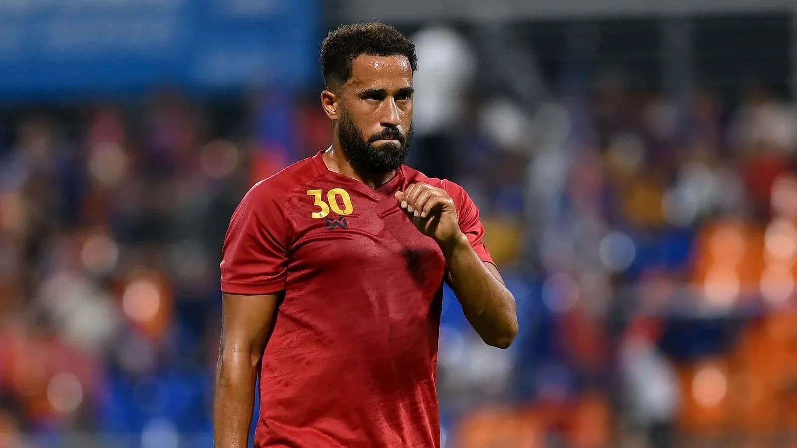 Player wearing red jersey during match warm-up Player wearing red jersey during match warm-up