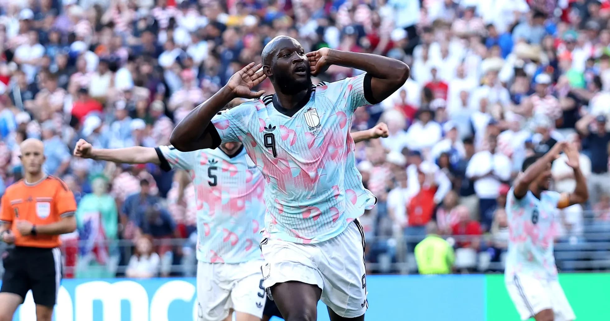 Player celebrating goal with hands on ears Player celebrating goal with hands on ears
