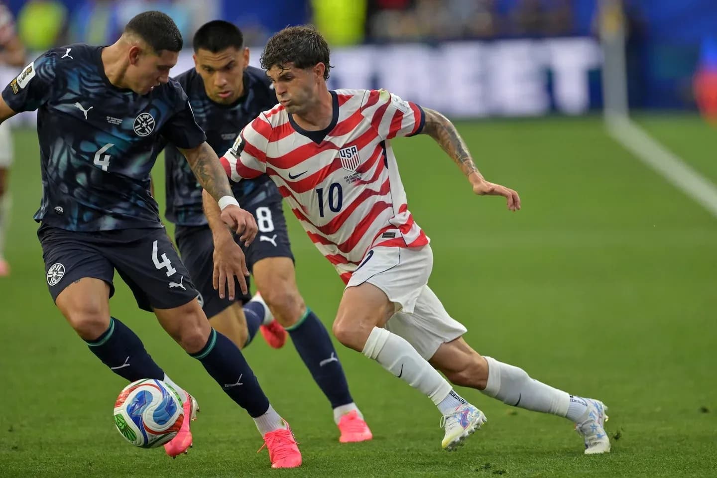 Players competing for the ball during a match Players competing for the ball during a match