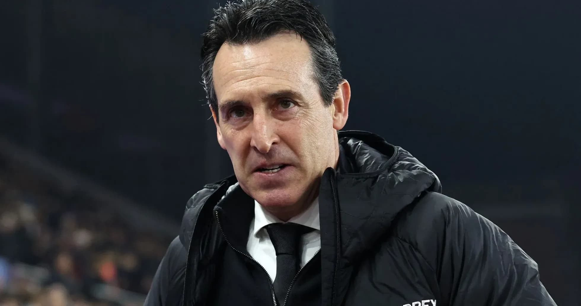 Coach wearing black jacket during match preparation Coach wearing black jacket during match preparation