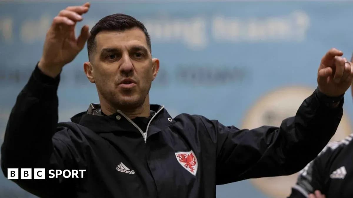 Coach gesturing during training session with team Coach gesturing during training session with team