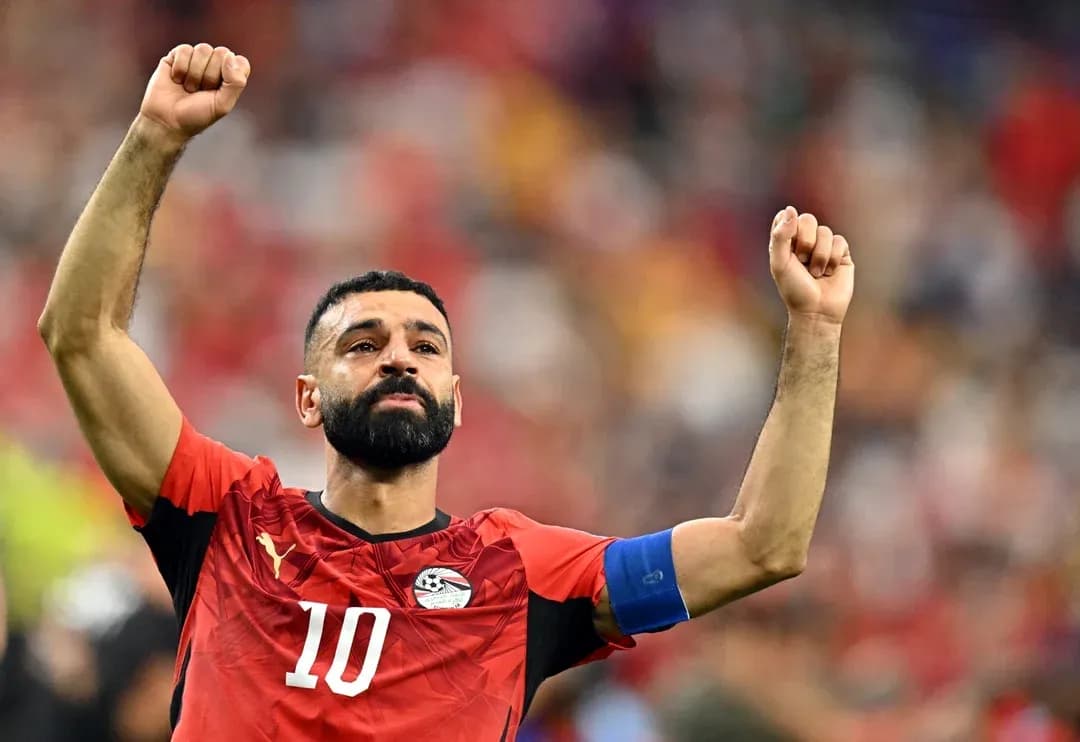 Player celebrating with raised arms during match Player celebrating with raised arms during match