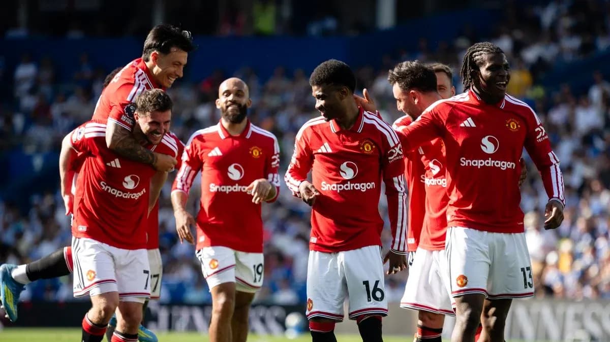 Manchester United players celebrating a goal together Manchester United players celebrating a goal together