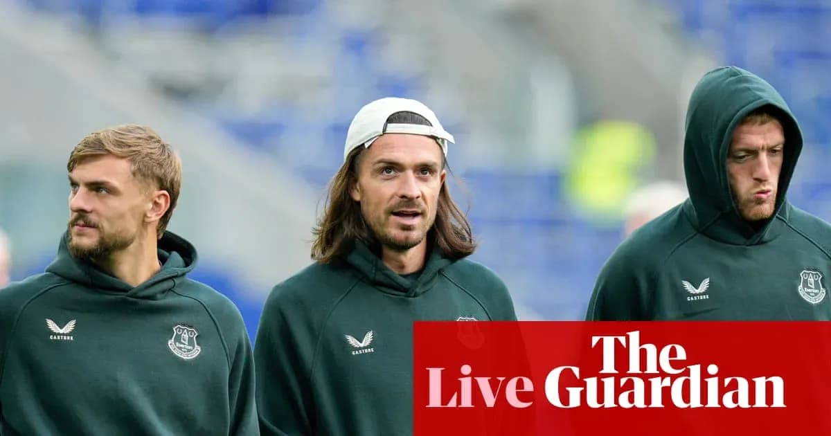 Three players walking in Everton training hoodies Three players walking in Everton training hoodies