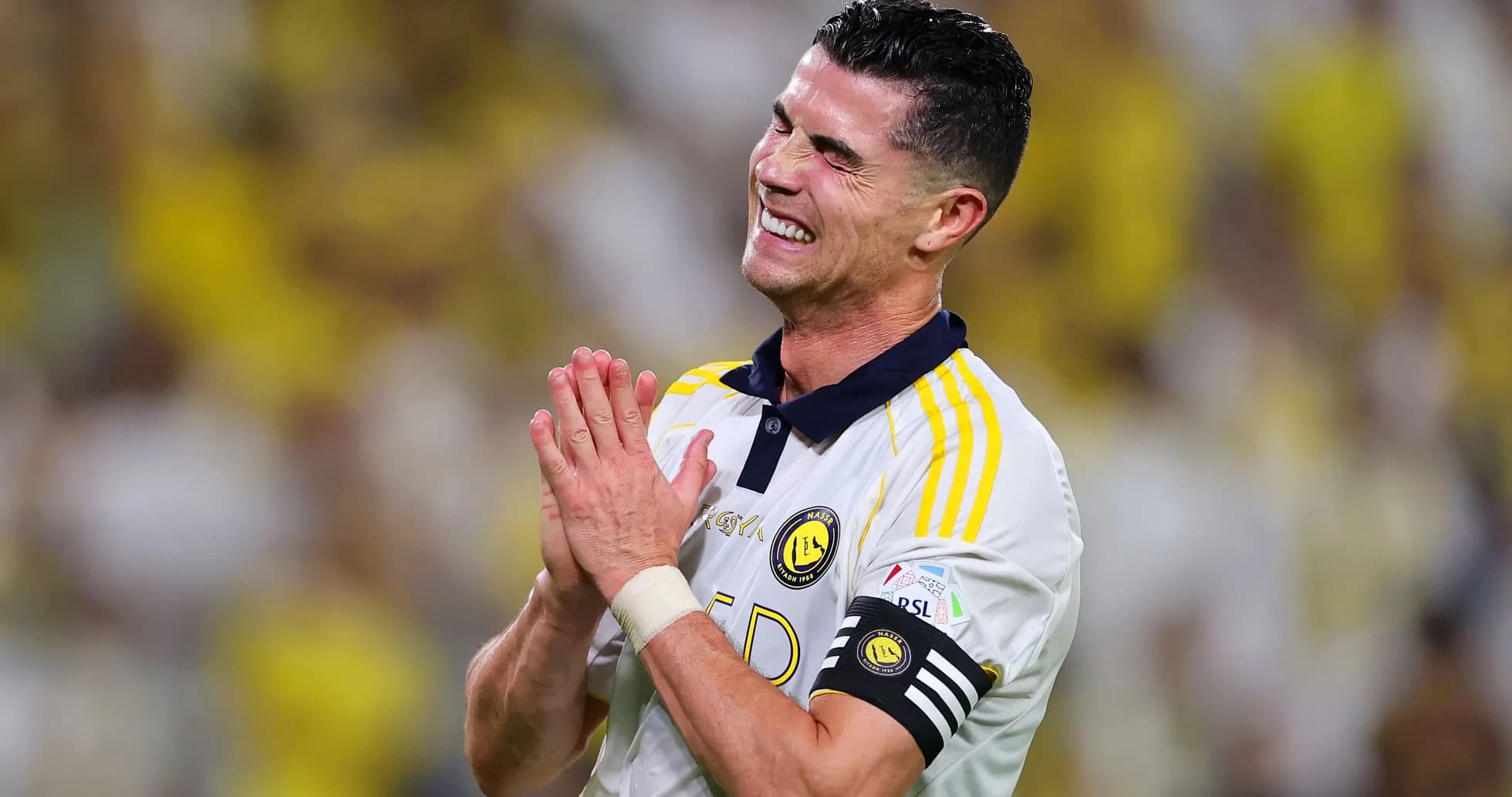 Player celebrating with hands clasped during match Player celebrating with hands clasped during match