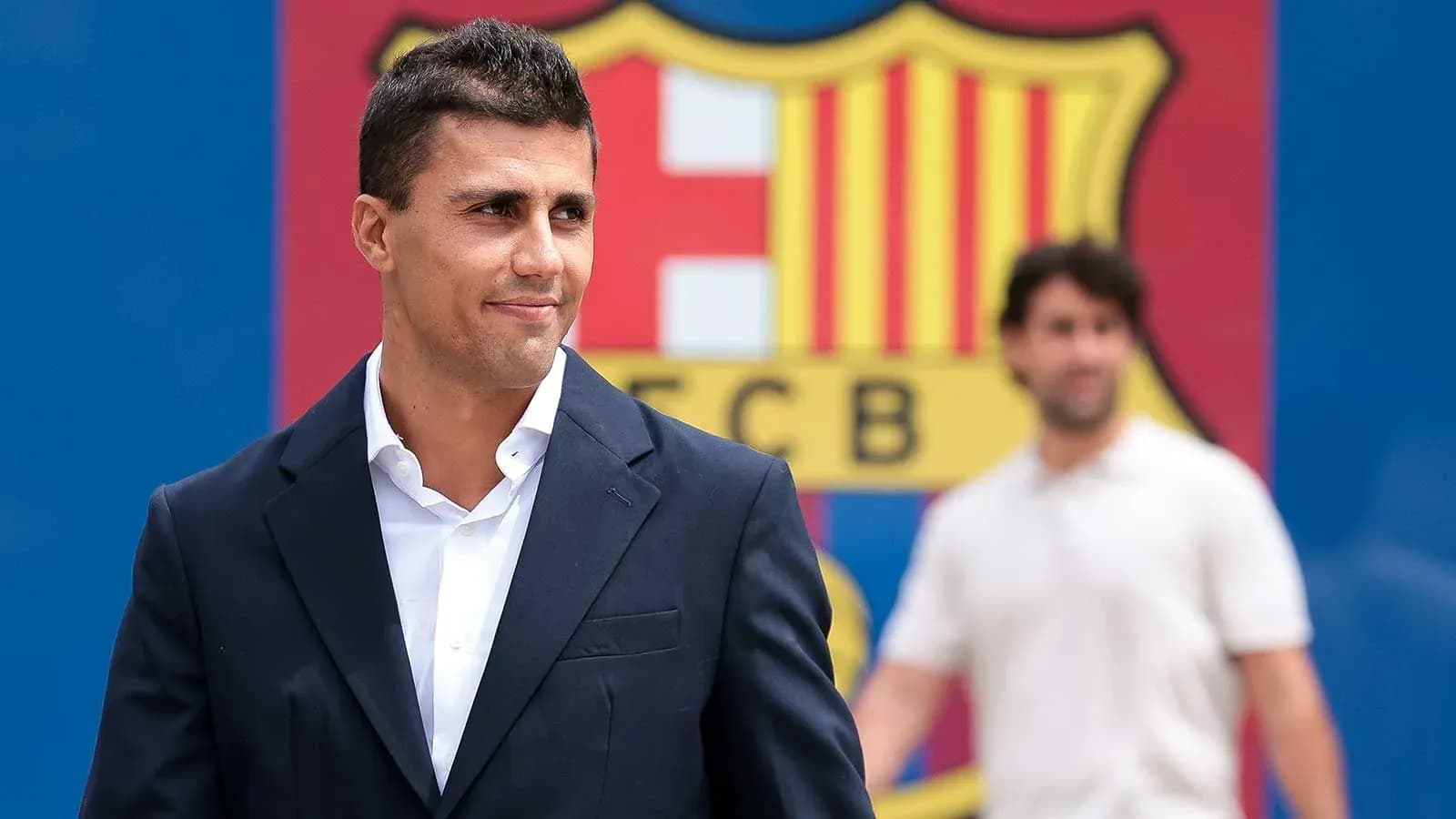 New signing posing in front of FC Barcelona logo New signing posing in front of FC Barcelona logo