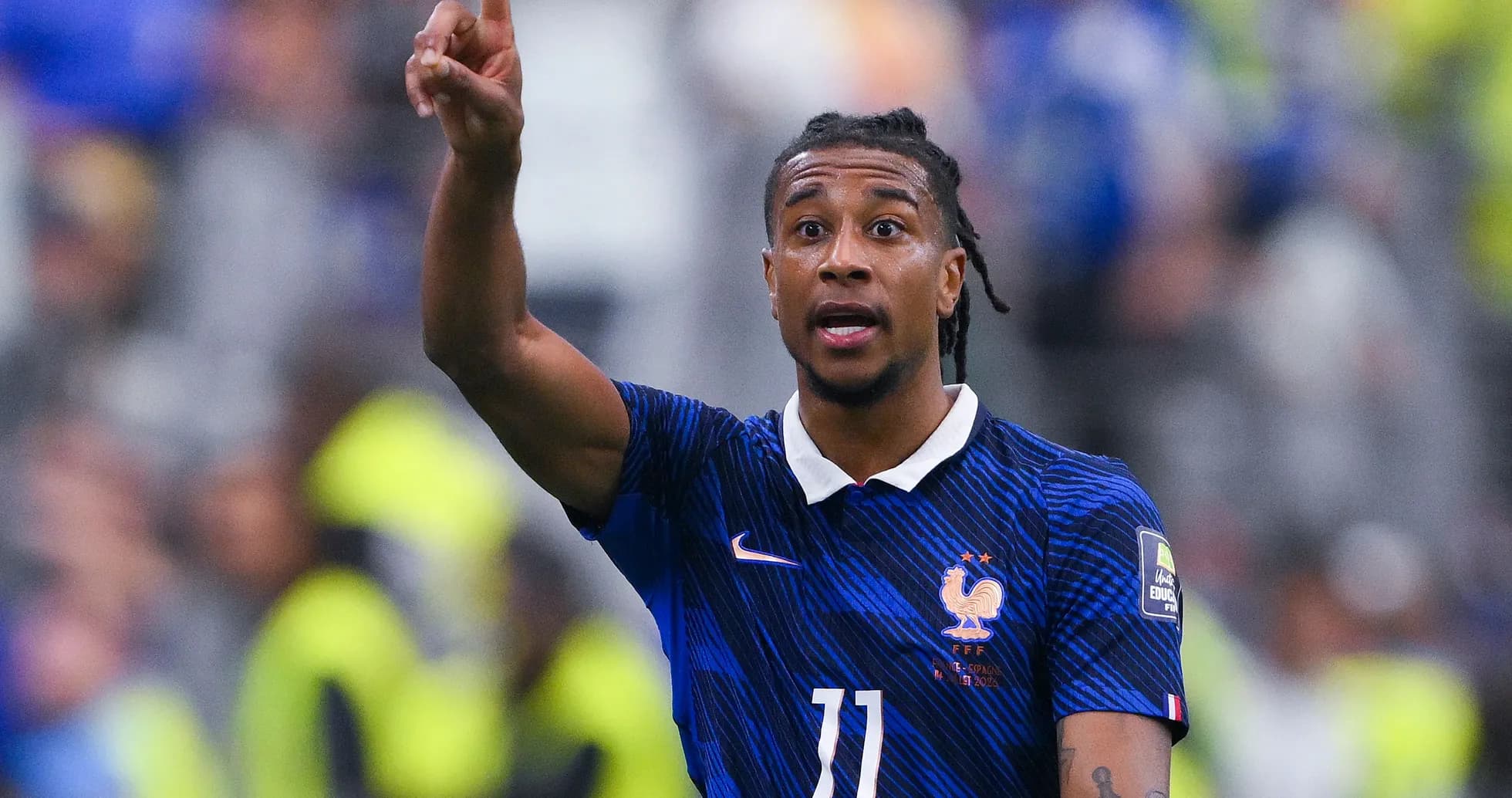 Player gesturing during a football match Player gesturing during a football match