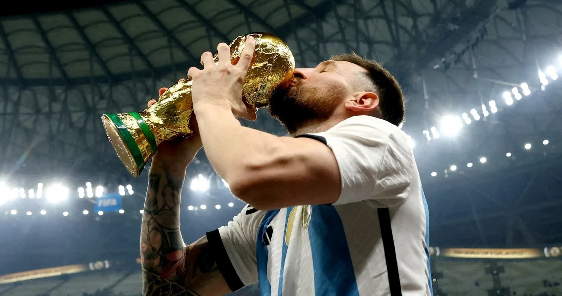 Player celebrating by kissing World Cup trophy Player celebrating by kissing World Cup trophy