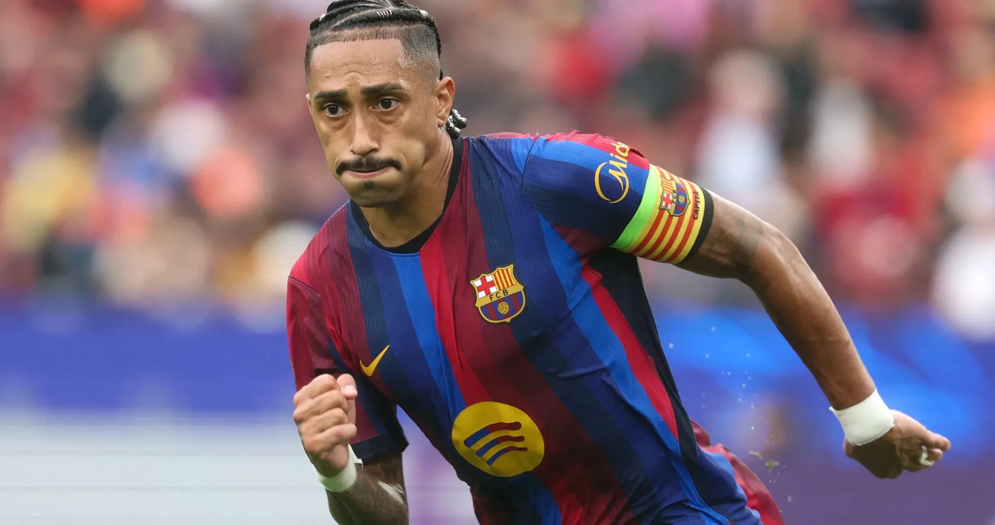 Barcelona player running during a match Barcelona player running during a match