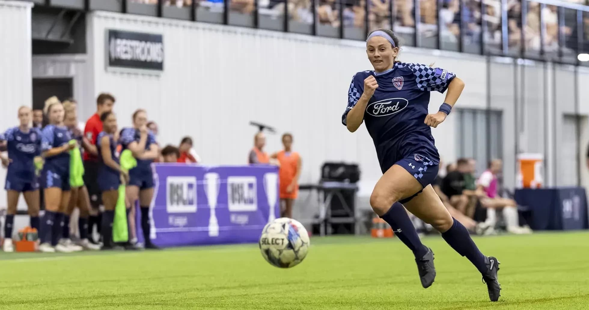 Player sprinting with ball during USL match Player sprinting with ball during USL match