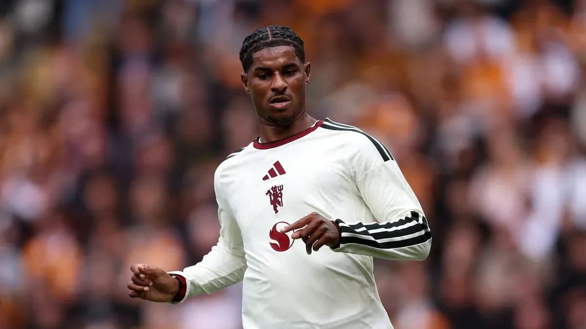 Player in white kit during match action Player in white kit during match action