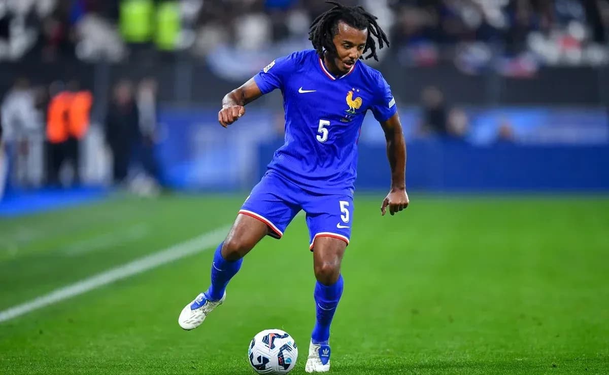Player in blue kit dribbling soccer ball on field Player in blue kit dribbling soccer ball on field