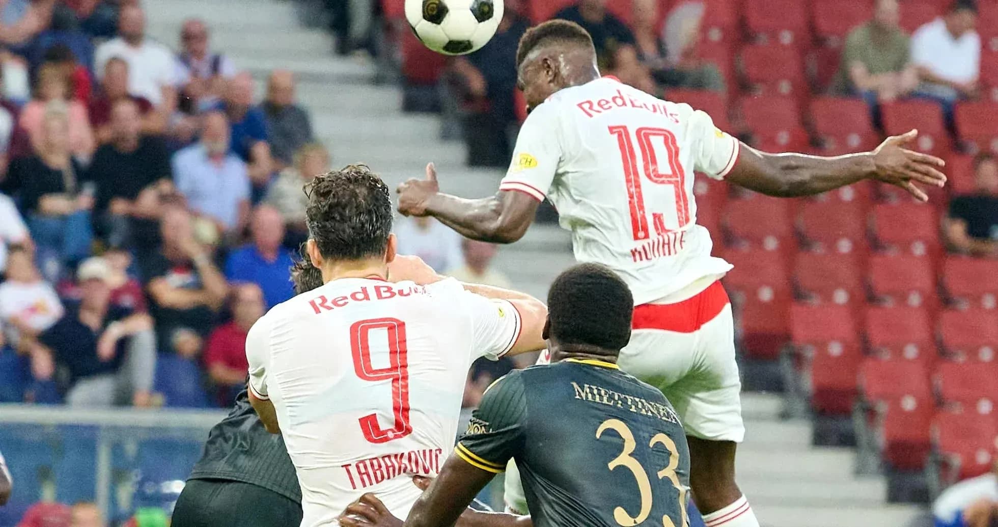 Players contesting for the ball during match Players contesting for the ball during match