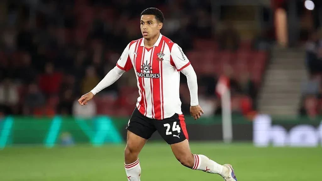 Player wearing Southampton kit running on the pitch Player wearing Southampton kit running on the pitch