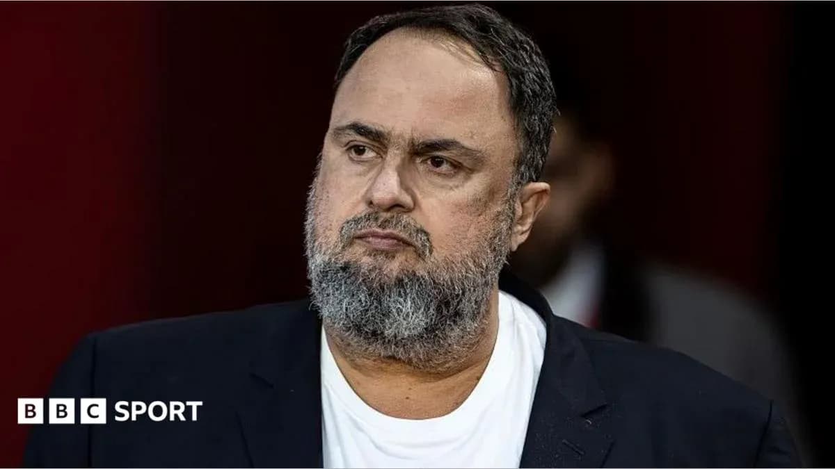 Man with beard wearing a black suit jacket Man with beard wearing a black suit jacket