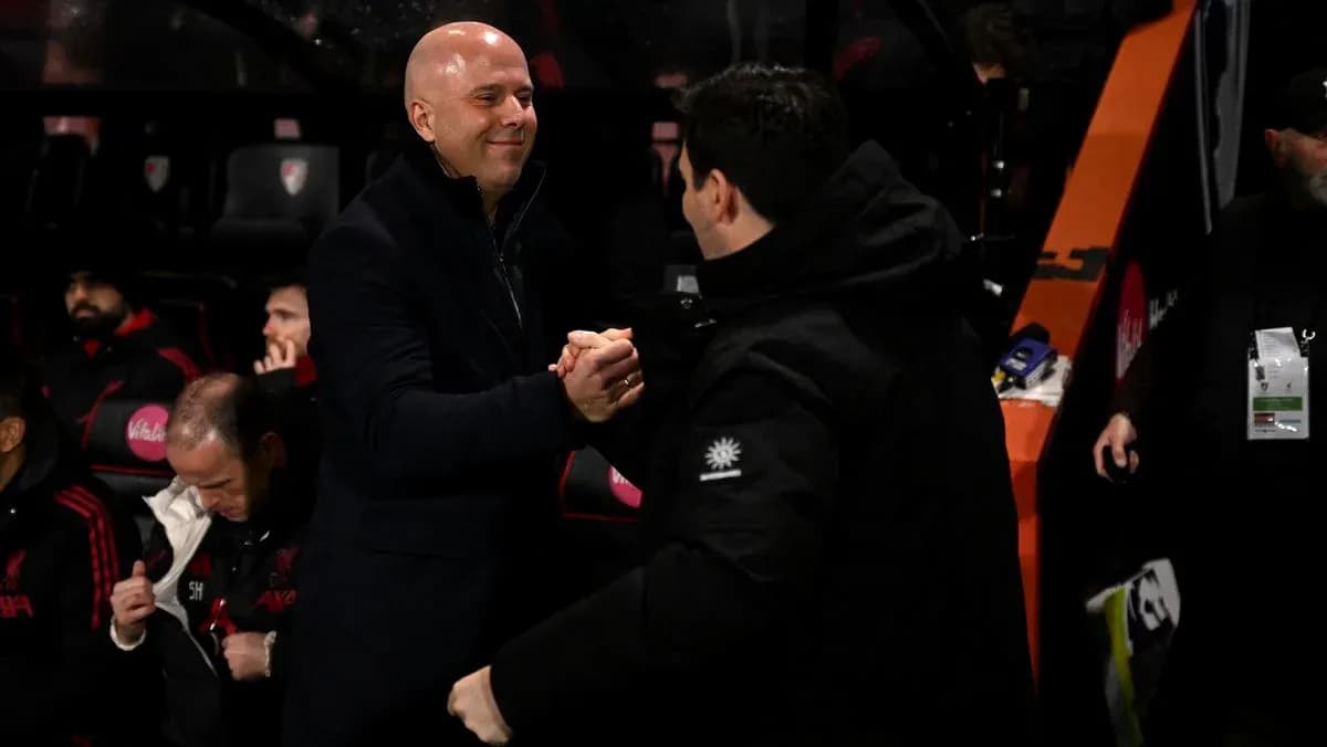 Two coaches shaking hands on the sidelines Two coaches shaking hands on the sidelines