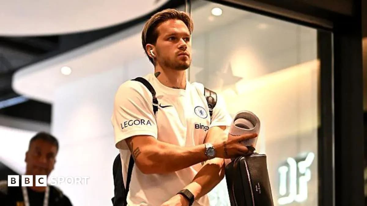 Player arriving at venue carrying equipment and headphones Player arriving at venue carrying equipment and headphones