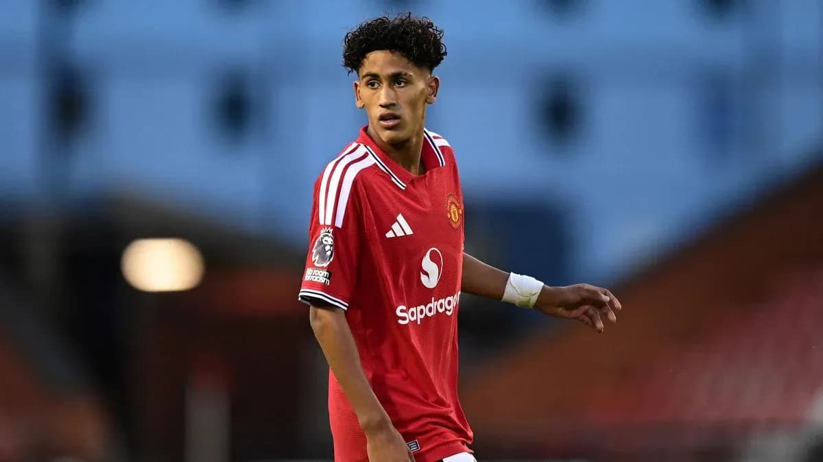 Player in red Manchester United kit during match Player in red Manchester United kit during match
