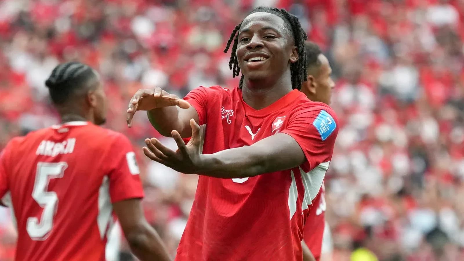 Swiss player celebrating with teammates during match Swiss player celebrating with teammates during match