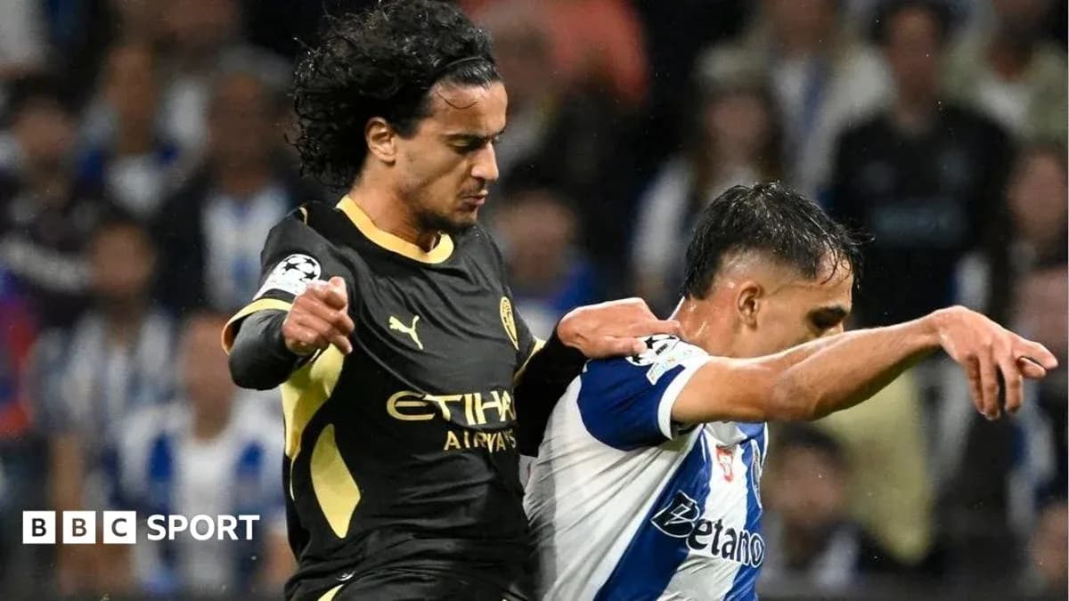 Two players in a competitive tackle during match Two players in a competitive tackle during match