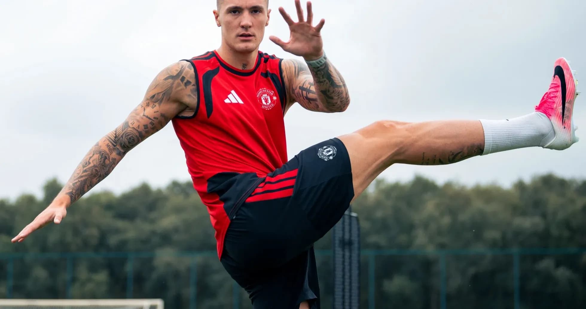 Player training with high kick on football pitch Player training with high kick on football pitch