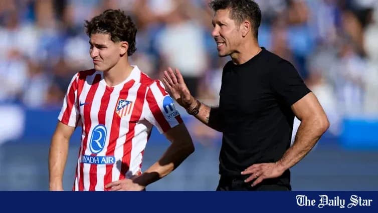 Atletico Madrid coach speaking to player during match Atletico Madrid coach speaking to player during match