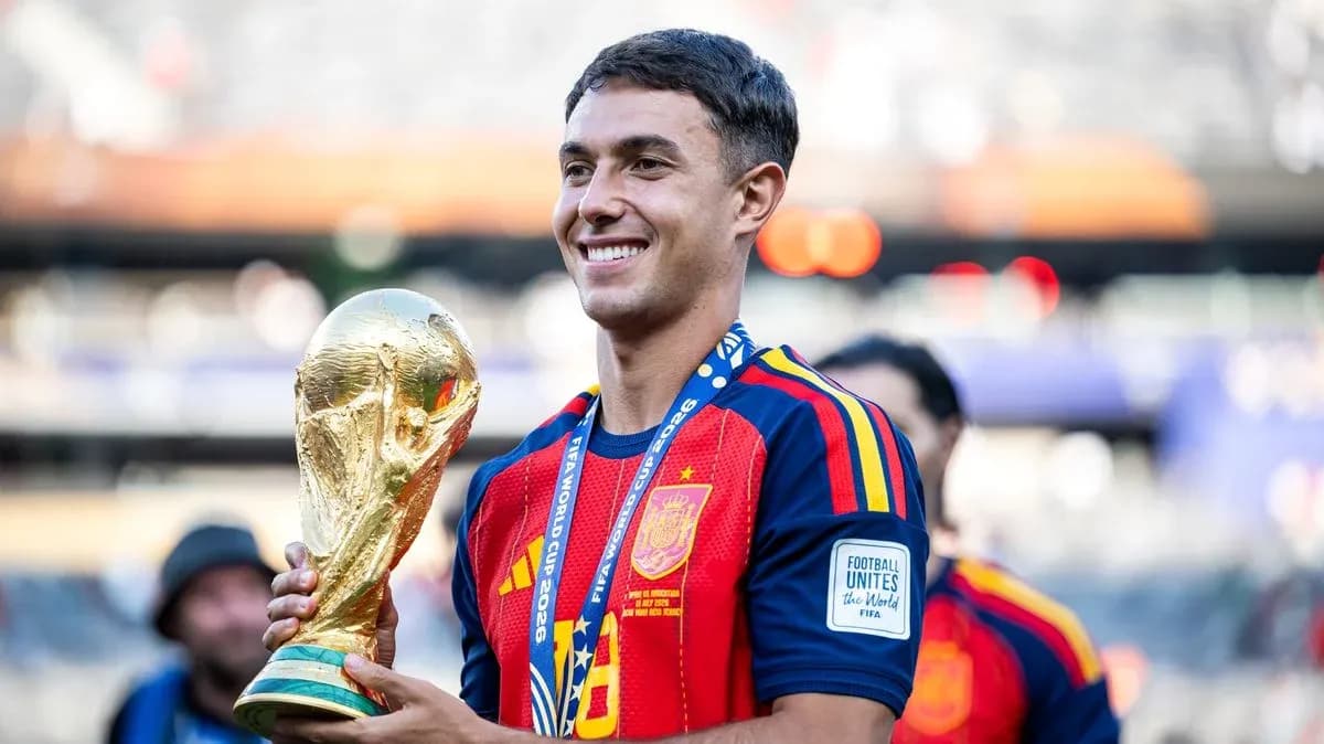 Player holding FIFA World Cup trophy in stadium Player holding FIFA World Cup trophy in stadium