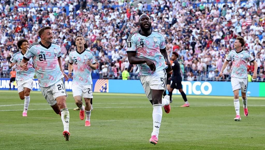 Players celebrating a goal during soccer match Players celebrating a goal during soccer match